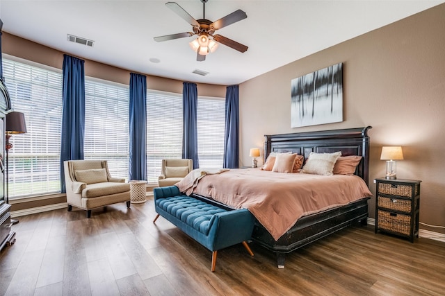 9720 Birdville Way, Fort Worth, TX 76244 - bedroom with wood finished floors, multiple windows, and baseboards