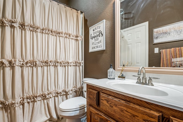 9720 Birdville Way, Fort Worth, TX 76244 - full bathroom featuring a textured wall, toilet, vanity, and curtained shower