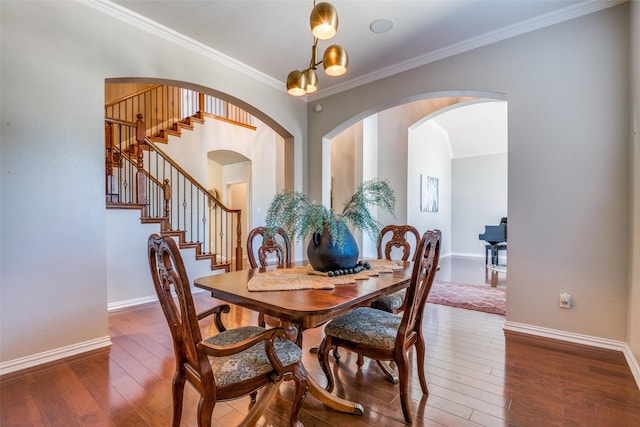 9720 Birdville Way, Fort Worth, TX 76244 - dining space with crown molding, hardwood / wood-style flooring, stairs, arched walkways, and baseboards