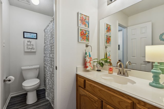 bathroom with vanity, hardwood / wood-style floors, toilet, and a shower with shower curtain