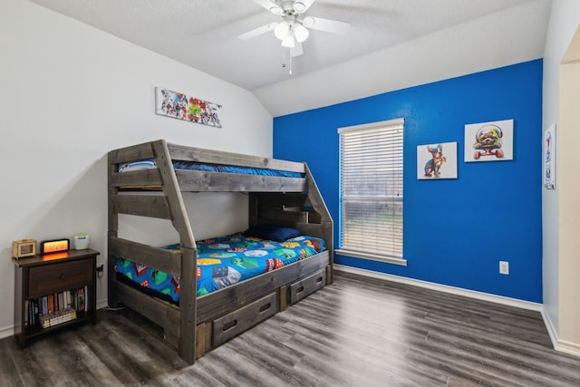 bedroom featuring lofted ceiling, dark wood-type flooring, and ceiling fan