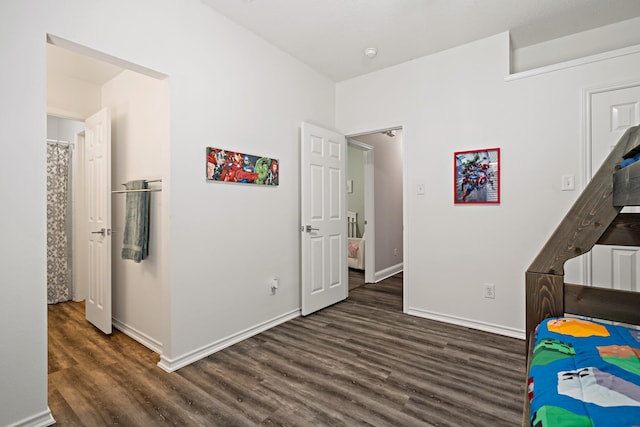 bedroom featuring dark wood-type flooring