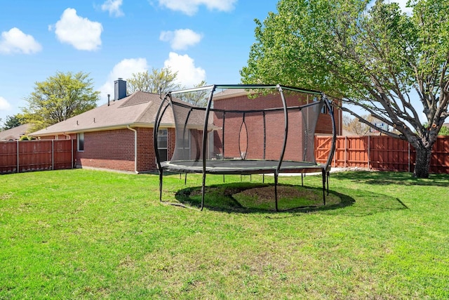 view of yard featuring a trampoline