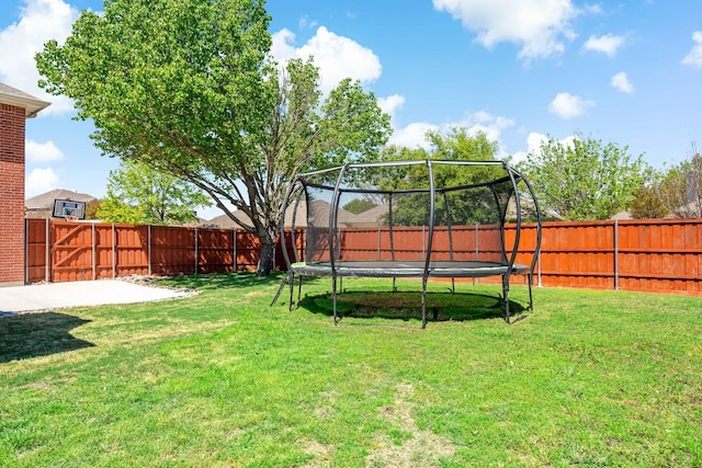 view of yard featuring a trampoline