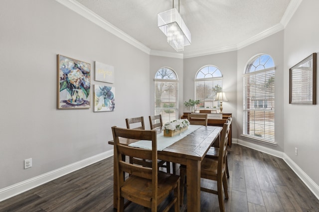 dining space featuring ornamental molding, dark wood-type flooring, a wealth of natural light, and a notable chandelier