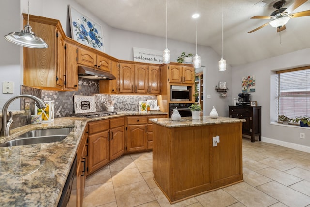 kitchen featuring sink, hanging light fixtures, a center island, and appliances with stainless steel finishes