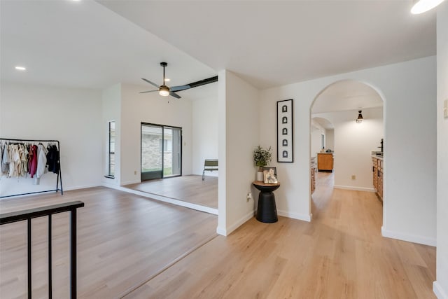 2410 Cedar Elm Ln, Garland, TX 75043 - foyer featuring ceiling fan, arched walkways, light wood-style floors, baseboards, and recessed lighting