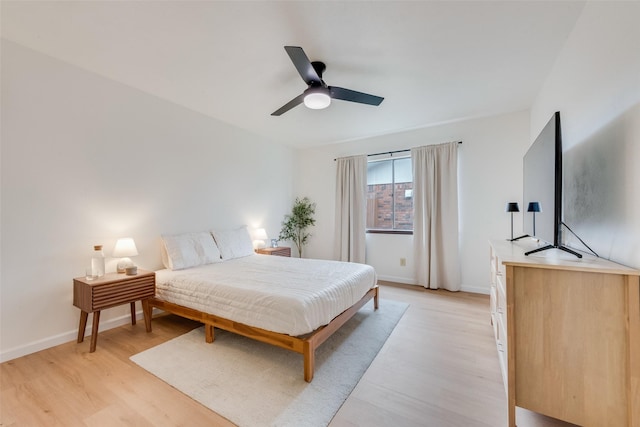 bedroom featuring ceiling fan and light hardwood / wood-style floors