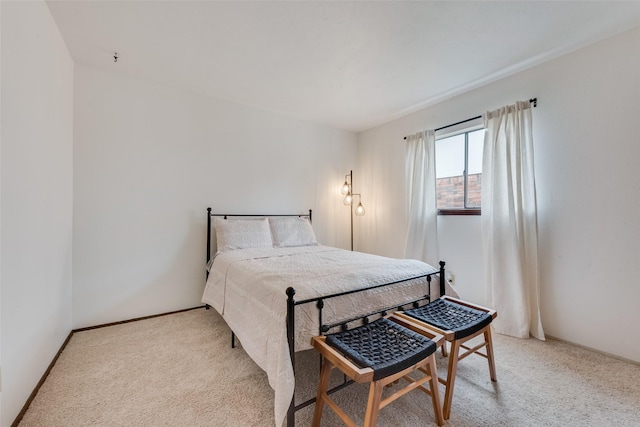 bedroom featuring light colored carpet