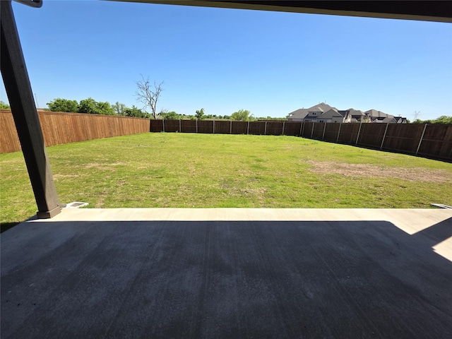 view of yard with a fenced backyard and a patio