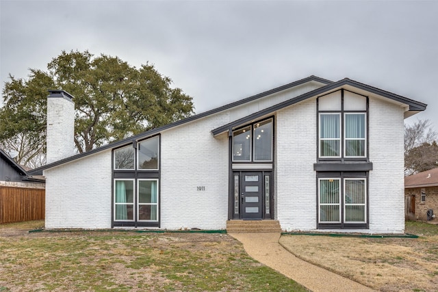 view of front of house with a front lawn