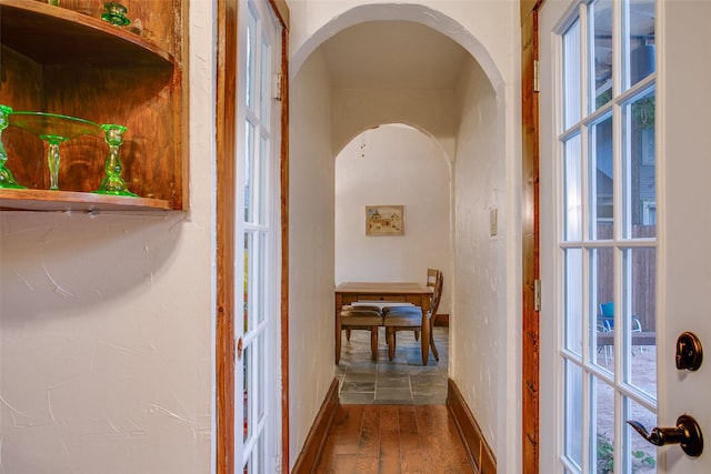 hall with hardwood / wood-style floors