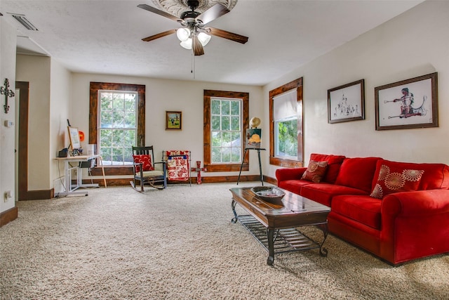 living room featuring carpet flooring and ceiling fan