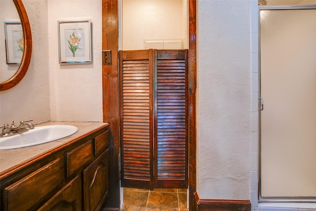 bathroom featuring vanity and walk in shower