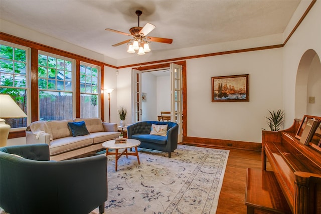 living room with hardwood / wood-style flooring and ceiling fan