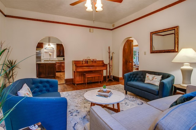 living room with dark wood-type flooring and ceiling fan