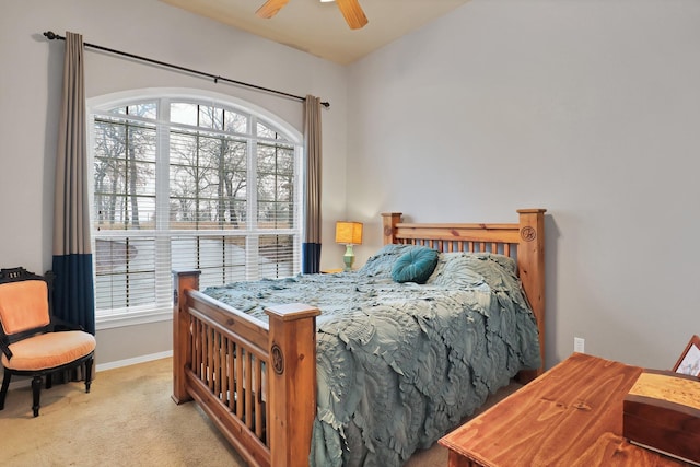 bedroom with ceiling fan and light carpet