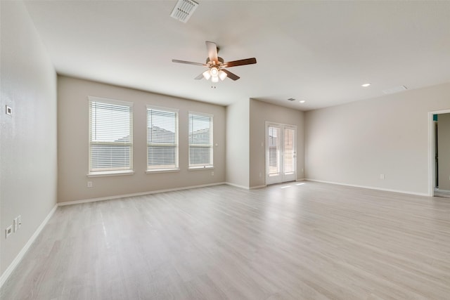 spare room with ceiling fan and light hardwood / wood-style flooring