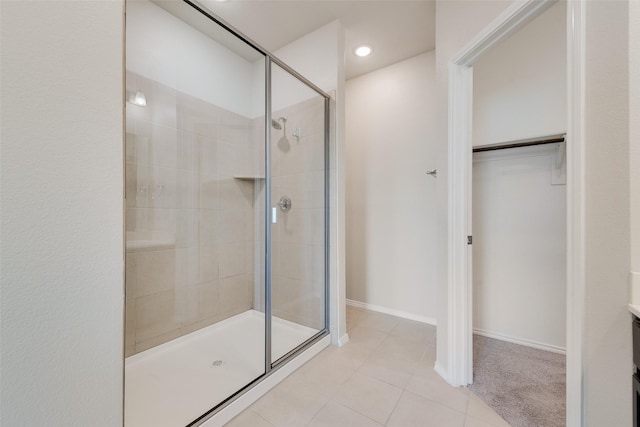 bathroom with tile patterned floors and an enclosed shower