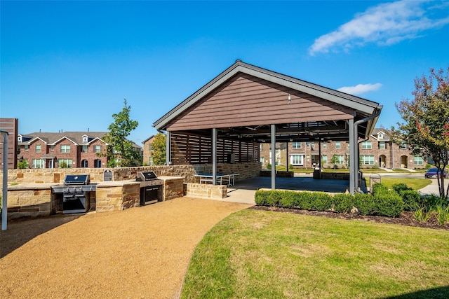 view of property's community with a patio and area for grilling