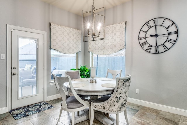 15805 Rockingham St, Frisco, TX 75036 - dining space with a chandelier, healthy amount of natural light, and baseboards