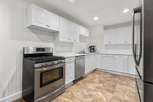 kitchen featuring stainless steel appliances, sink, and white cabinets