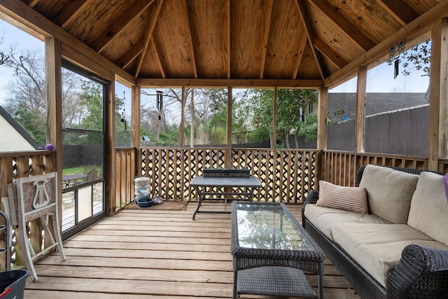 sunroom with lofted ceiling and wooden ceiling