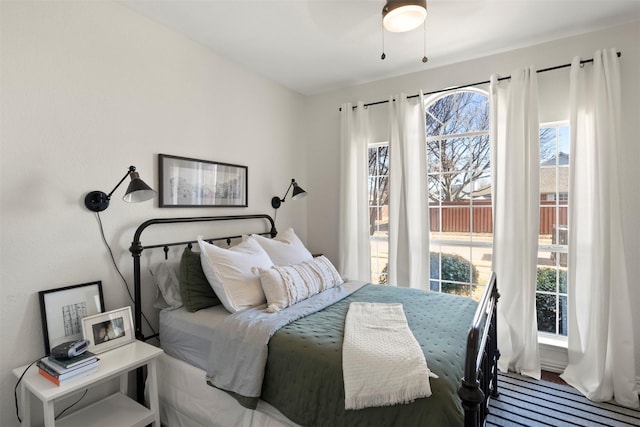 bedroom featuring multiple windows and ceiling fan