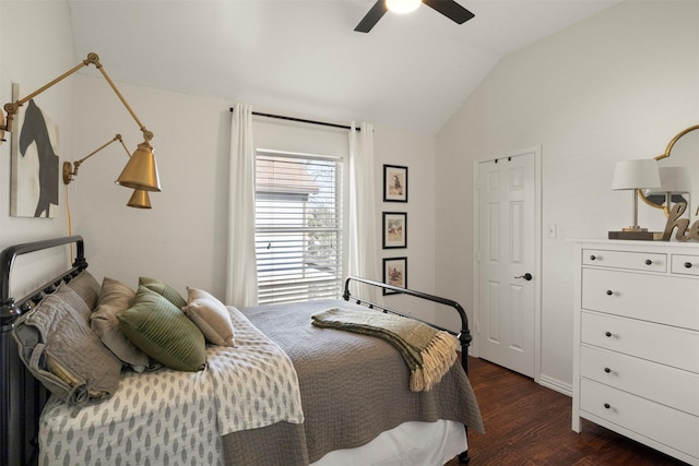 bedroom with vaulted ceiling, dark hardwood / wood-style floors, and ceiling fan