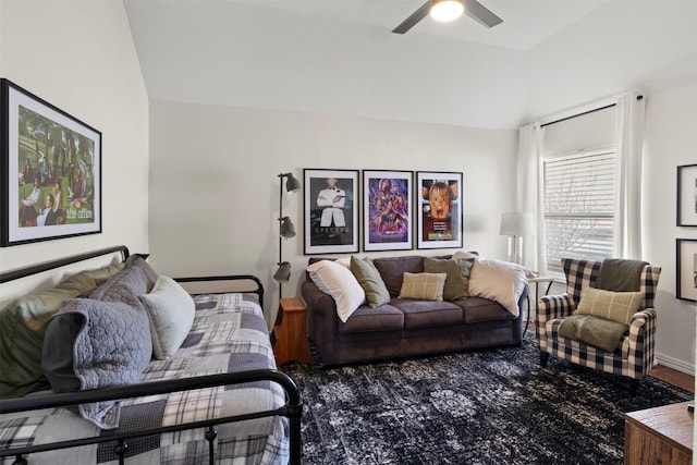 living room featuring ceiling fan and lofted ceiling