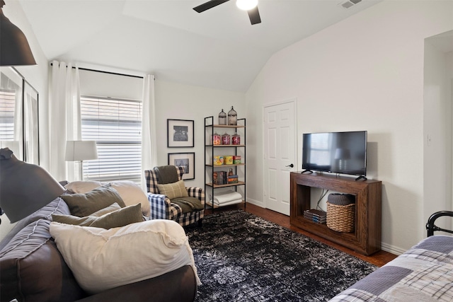 living room featuring ceiling fan and lofted ceiling