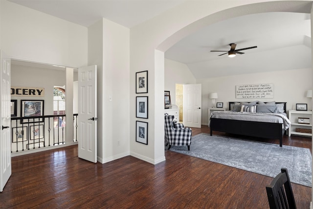 bedroom with dark wood-type flooring and vaulted ceiling