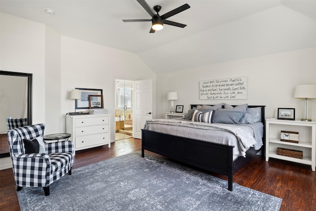 bedroom featuring lofted ceiling, connected bathroom, dark hardwood / wood-style floors, and ceiling fan