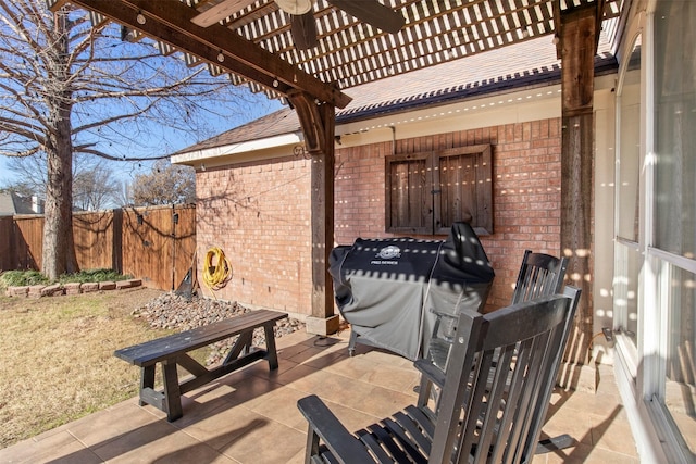 view of patio / terrace with area for grilling and a pergola