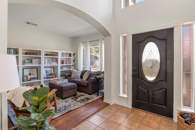 foyer entrance featuring light tile patterned floors