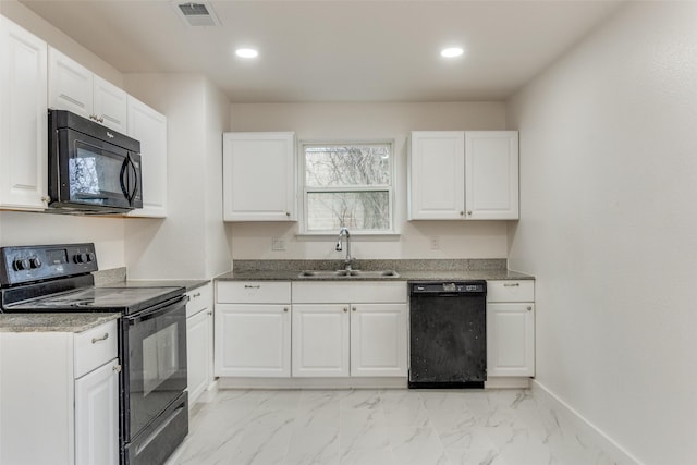 kitchen featuring white cabinetry, sink, and black appliances