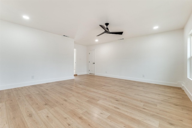 unfurnished room featuring ceiling fan and light wood-type flooring