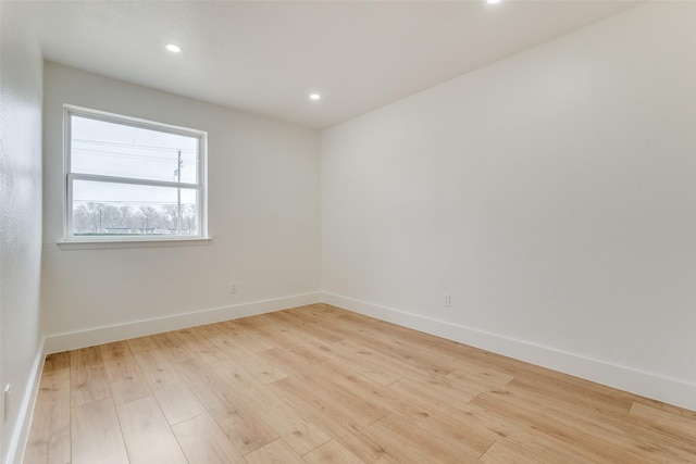 spare room featuring light hardwood / wood-style floors