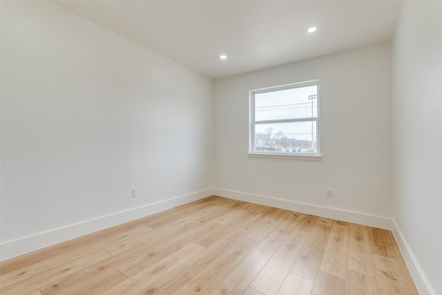 empty room with light hardwood / wood-style floors