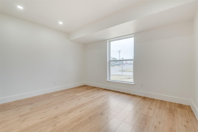 unfurnished room featuring light hardwood / wood-style floors