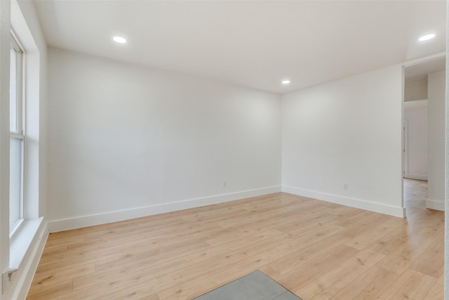 empty room featuring light hardwood / wood-style floors and a wealth of natural light