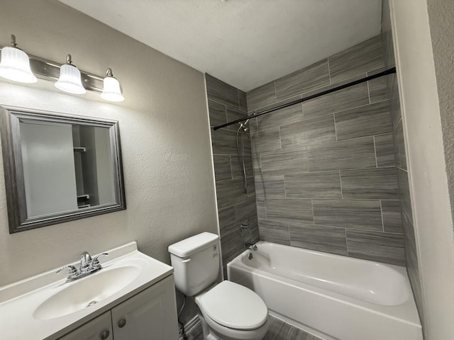 full bathroom with vanity, toilet, and tiled shower / bath