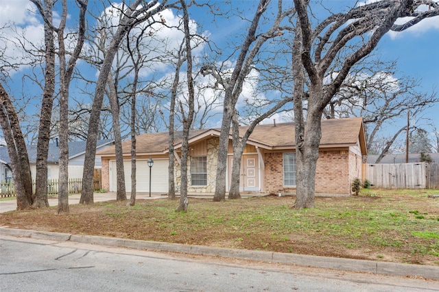 single story home with a garage