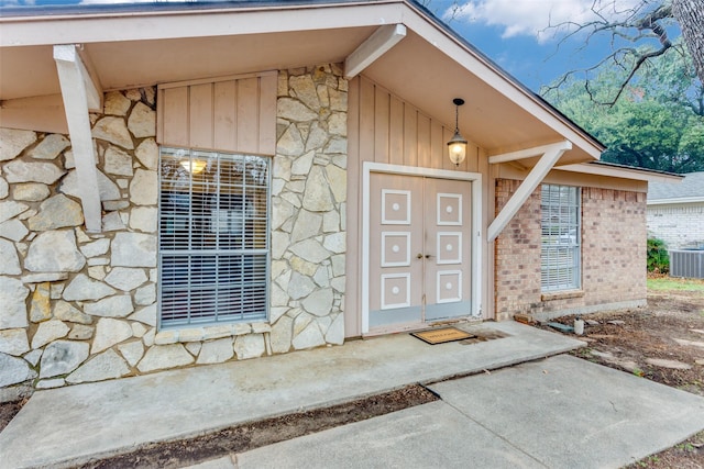 view of exterior entry with central AC