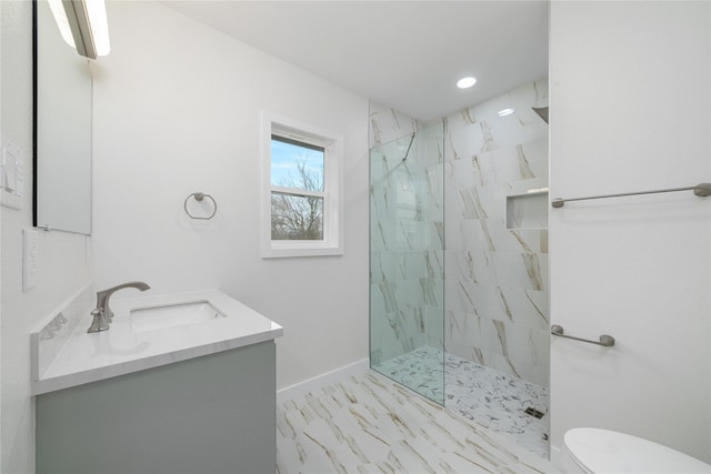 full bathroom featuring vanity, baseboards, a marble finish shower, toilet, and marble finish floor