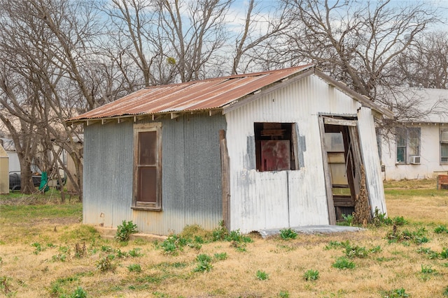 view of outbuilding featuring cooling unit and an outbuilding