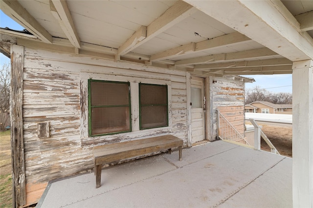 entrance to property featuring a patio