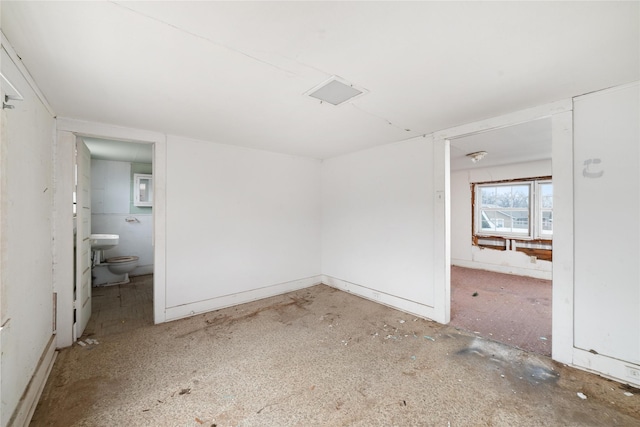 unfurnished bedroom featuring ensuite bath