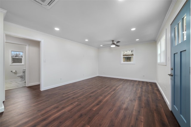 empty room with crown molding, dark hardwood / wood-style floors, and ceiling fan