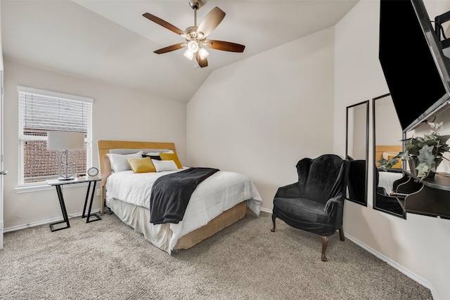 carpeted bedroom featuring lofted ceiling and ceiling fan